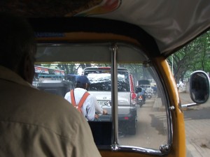 Colour Photograph showing the View from Inside an Auto-Rickshaw during Morning Rush Hour Traffic in Bengaluru, Southern India. Click to enlarge. Photograph taken by CJ Walsh. 2008-08-07.