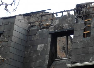 Colour photograph showing the Detail of a Party Wall ... the wall separating one property from another ... in the aftermath of the fires at a Terrace of Housing in Terenure, Dublin. Photograph taken by CJ Walsh. 2011-04-04. Click to enlarge.