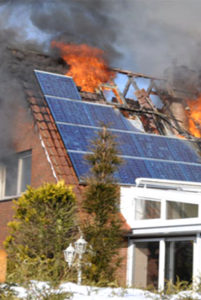 Colour photograph showing a house fire caused by Solar Photovoltaic Roof Panels.
